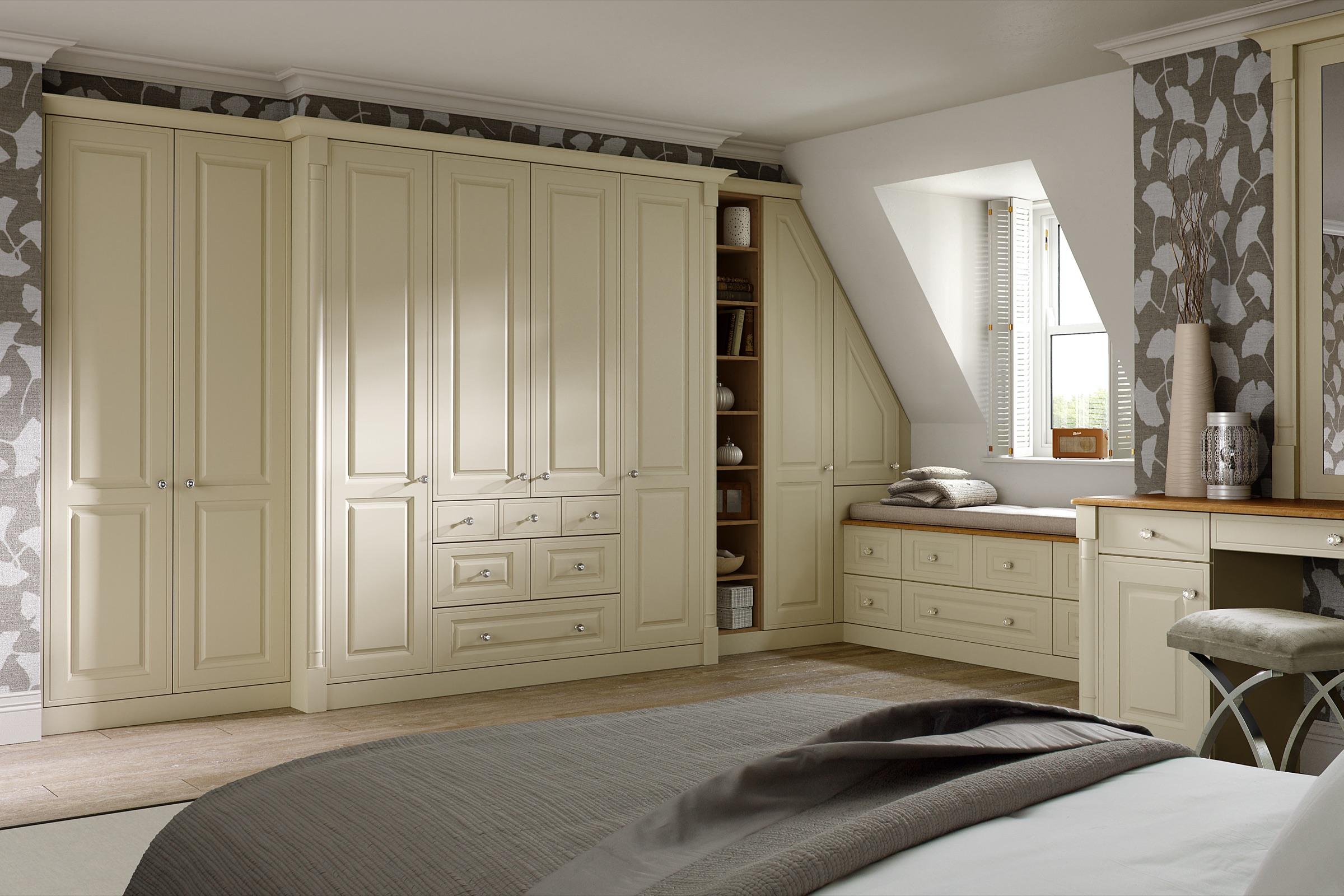 Daval 'Windsor' fitted wardrobes in cream, with a window seat and dressing table